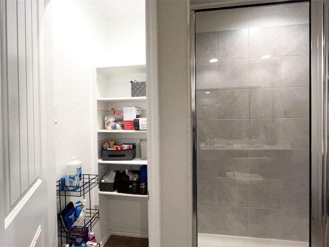 bathroom featuring built in features and walk in shower