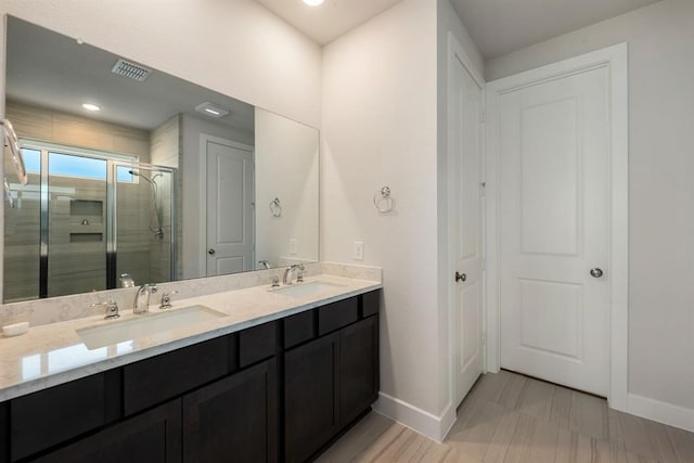 bathroom with vanity and walk in shower