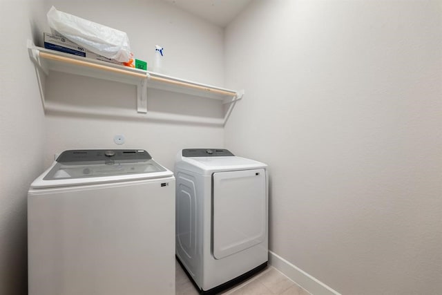 laundry room with washing machine and clothes dryer