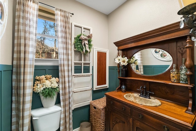 bathroom with vanity and toilet