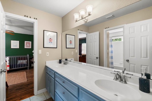 bathroom with vanity, shower / tub combo, and tile patterned floors