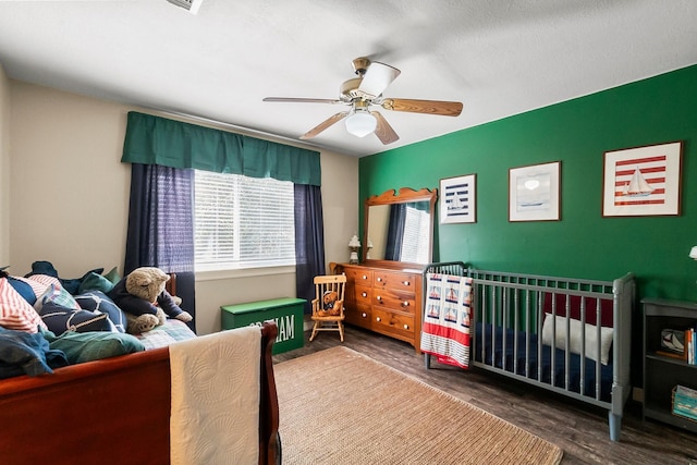 bedroom featuring hardwood / wood-style flooring and ceiling fan