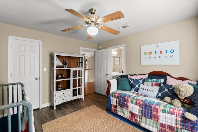 bedroom with dark hardwood / wood-style flooring, ceiling fan, and ensuite bathroom