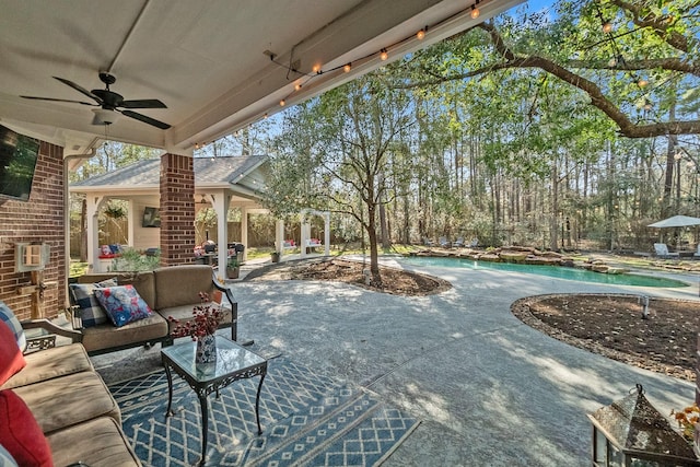 view of patio featuring an outdoor living space and ceiling fan