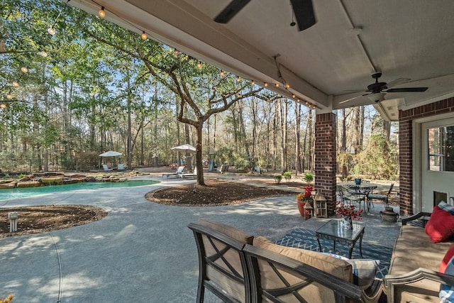 view of patio featuring ceiling fan