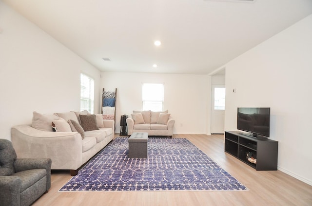 living room with light hardwood / wood-style floors