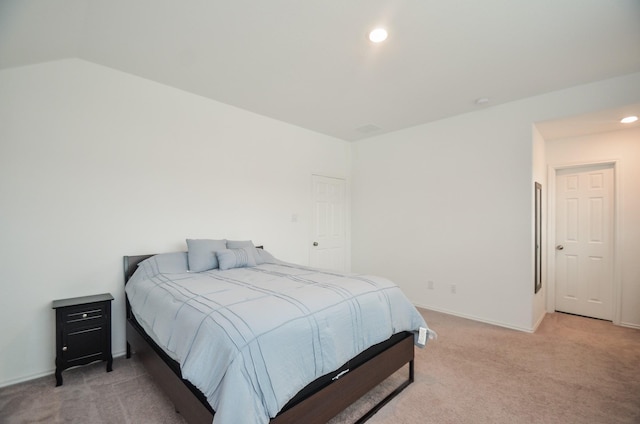 bedroom featuring light colored carpet