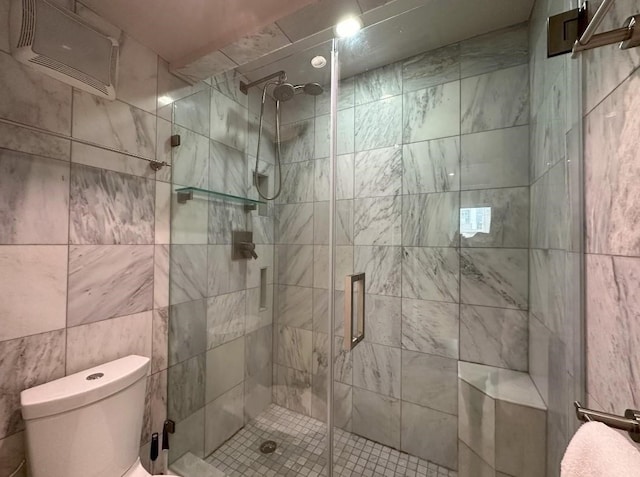 full bathroom featuring toilet and a stall shower