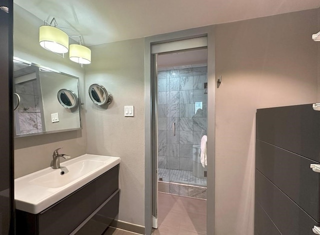 bathroom featuring a stall shower and vanity