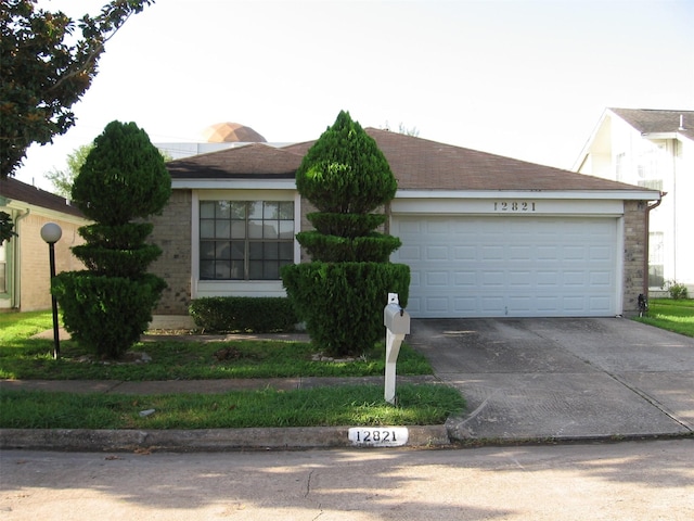 single story home with a garage