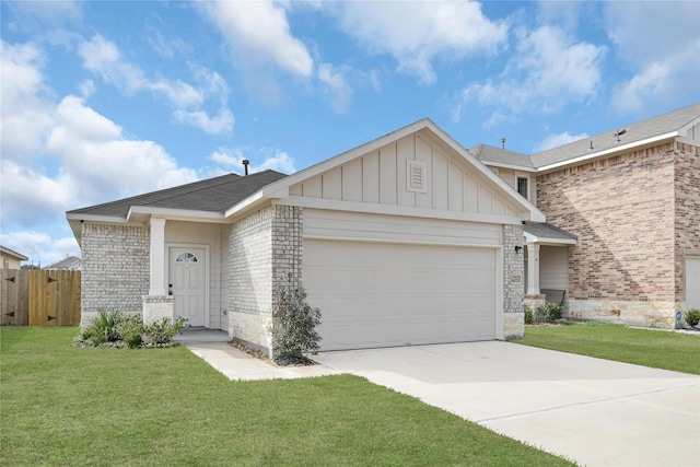 view of front of house featuring a front yard and a garage