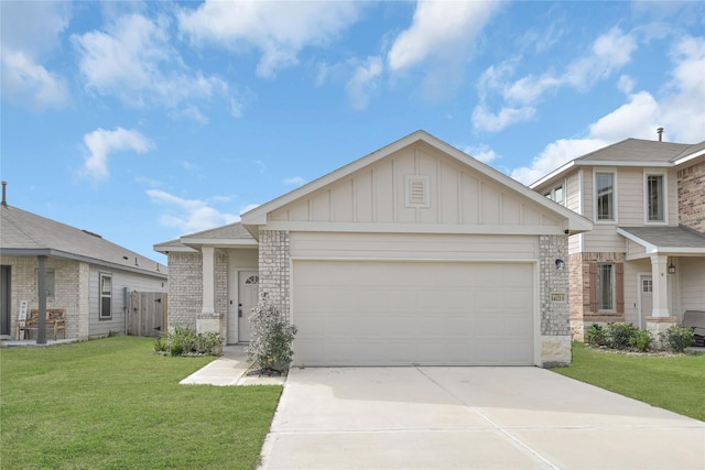 view of front of property with a front lawn and a garage