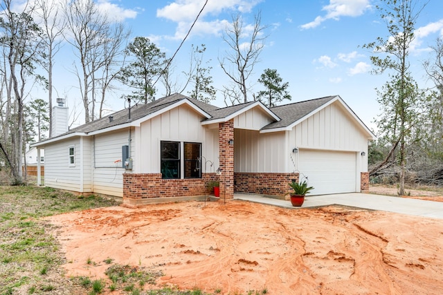 view of front of property with an attached garage, brick siding, concrete driveway, board and batten siding, and a chimney