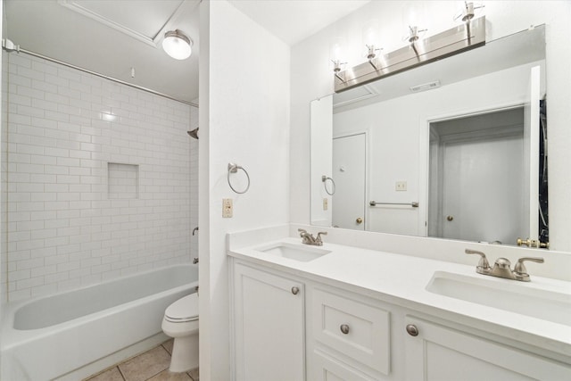 full bathroom with tiled shower / bath combo, toilet, tile patterned flooring, and vanity