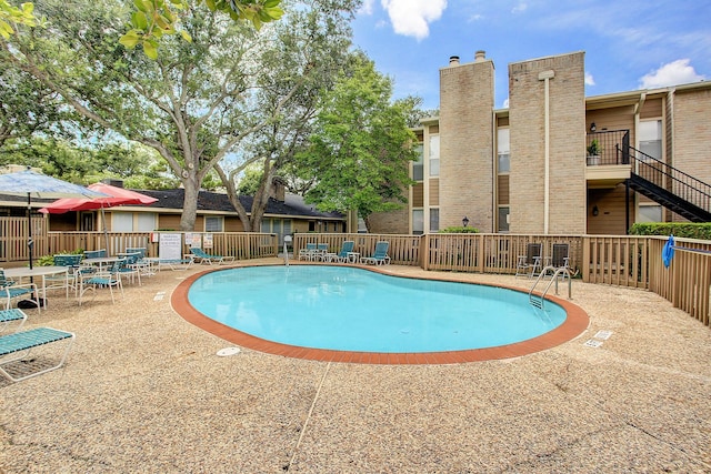 view of pool featuring a patio area