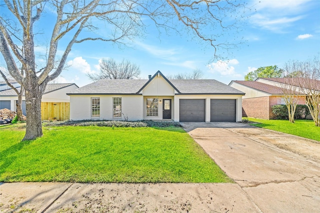 view of front of house featuring an attached garage, driveway, fence, and a front yard