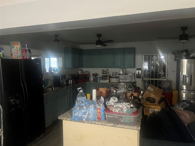 kitchen with hardwood / wood-style flooring, ceiling fan, stainless steel fridge, and black fridge with ice dispenser