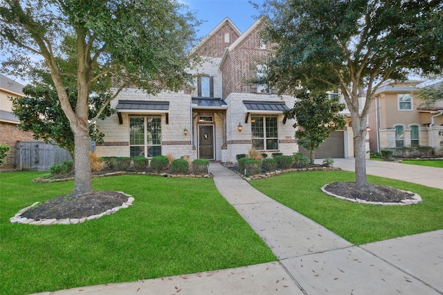 view of front facade with a front yard and a garage