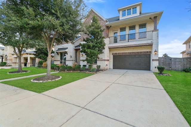 view of front of home featuring a garage, a balcony, and a front lawn