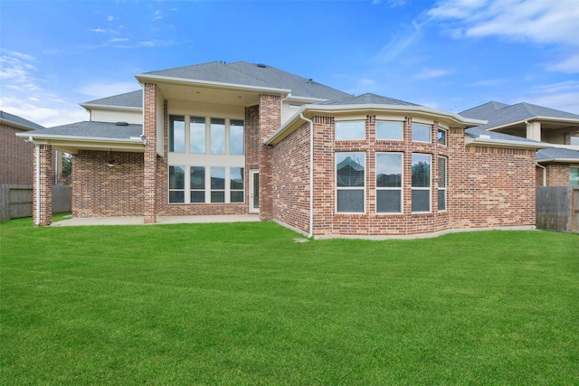 back of house featuring a yard and a patio area