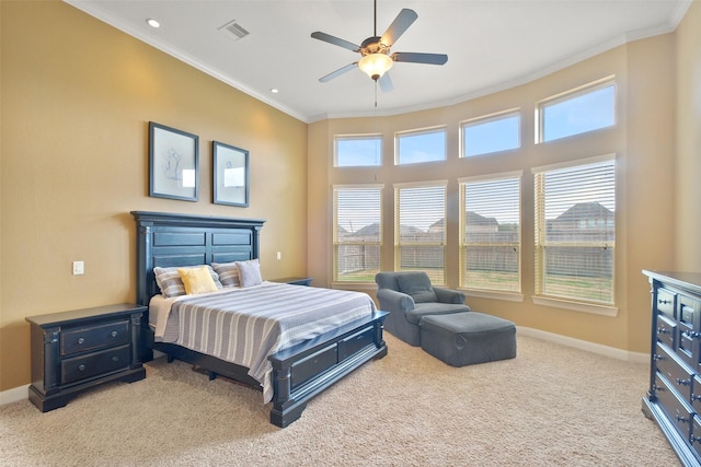 bedroom with carpet flooring, crown molding, and ceiling fan