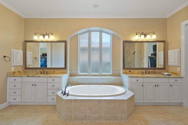 bathroom featuring tile patterned floors, crown molding, and vanity