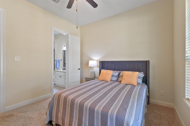 carpeted bedroom featuring ceiling fan and connected bathroom