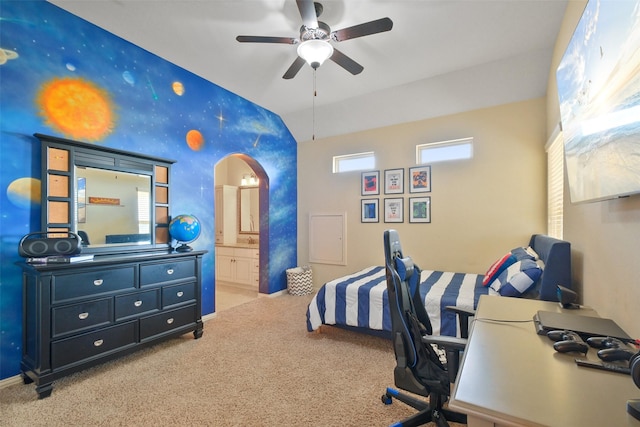 bedroom featuring ceiling fan, connected bathroom, and light colored carpet