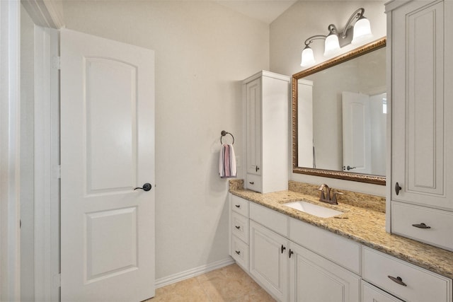 bathroom featuring tile patterned flooring and vanity