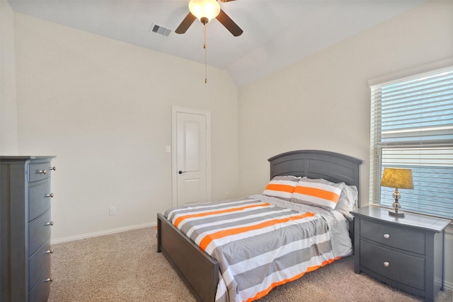 bedroom featuring ceiling fan, light colored carpet, and lofted ceiling