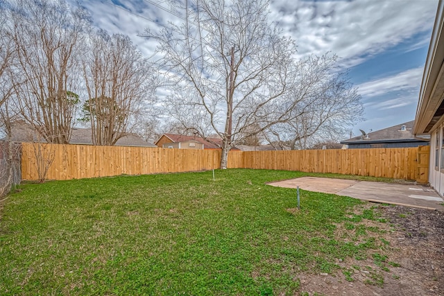 view of yard with a patio area and a fenced backyard