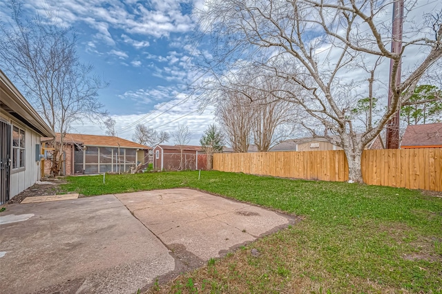 view of yard featuring a patio area and a fenced backyard