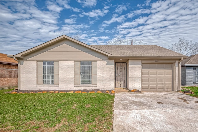 ranch-style home with an attached garage, brick siding, a shingled roof, concrete driveway, and a front lawn