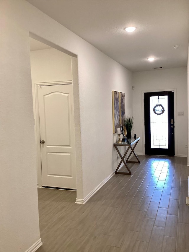 entryway with wood-type flooring