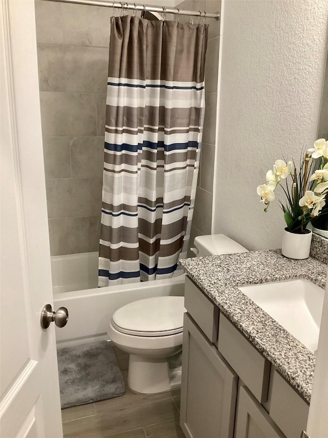 full bathroom featuring vanity, toilet, and shower / bath combo