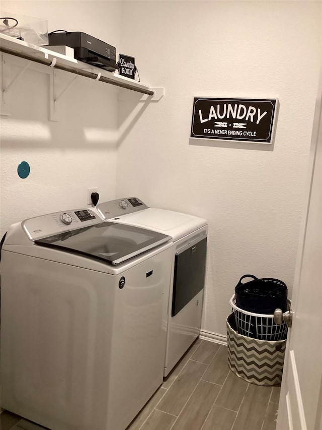 washroom with independent washer and dryer