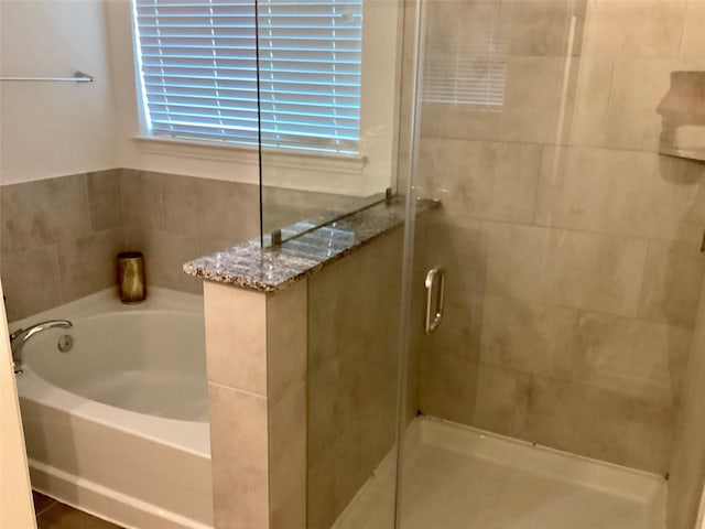 bathroom featuring plus walk in shower