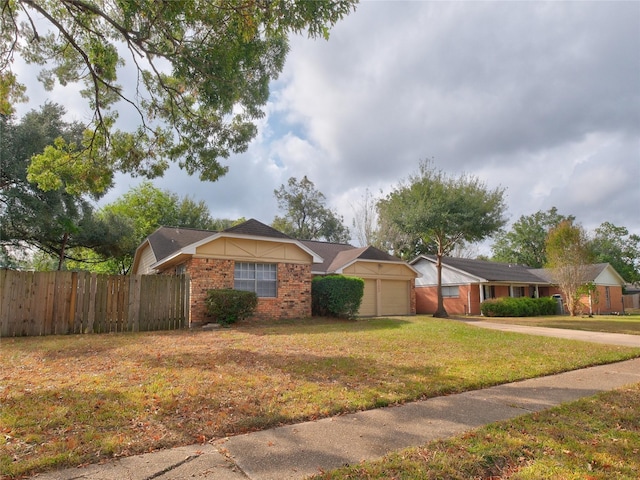 single story home featuring a front yard and a garage