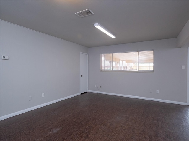 empty room featuring dark hardwood / wood-style floors