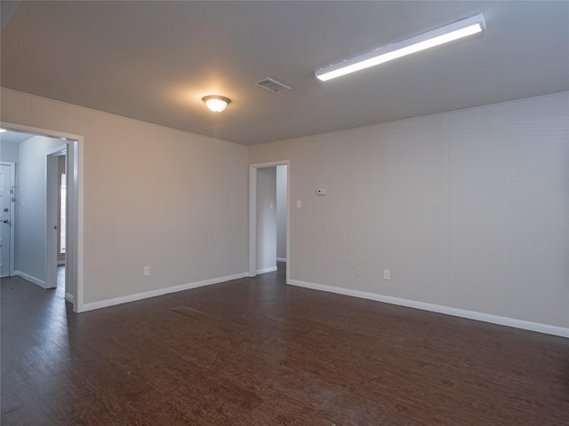 empty room with dark hardwood / wood-style floors