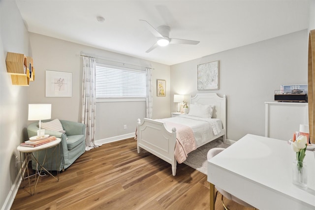 bedroom featuring hardwood / wood-style flooring and ceiling fan