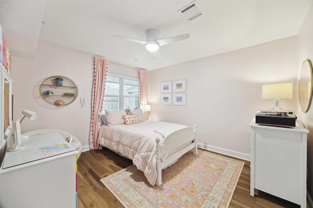 bedroom featuring ceiling fan and dark hardwood / wood-style flooring