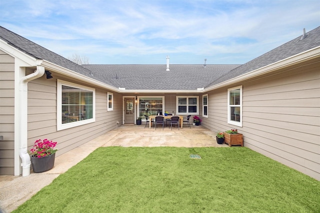 exterior space with a lawn and a patio