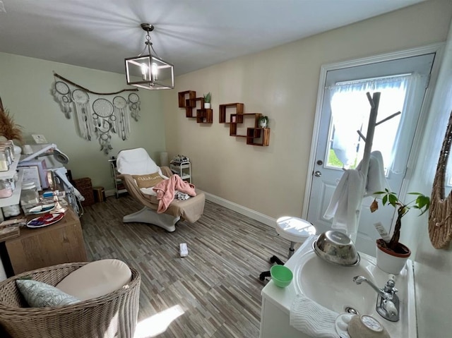 interior space featuring hardwood / wood-style flooring and a notable chandelier