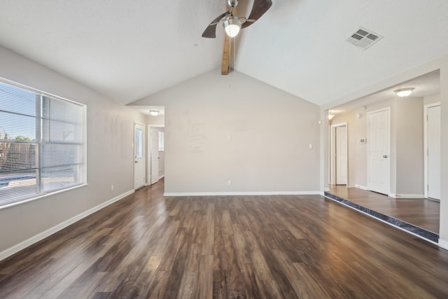 unfurnished living room with ceiling fan, lofted ceiling with beams, visible vents, wood finished floors, and baseboards