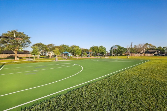 view of sport court with community basketball court, a yard, and playground community
