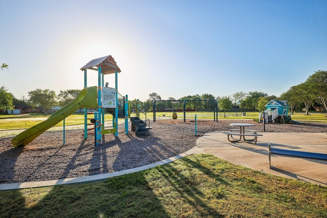 community play area featuring a yard