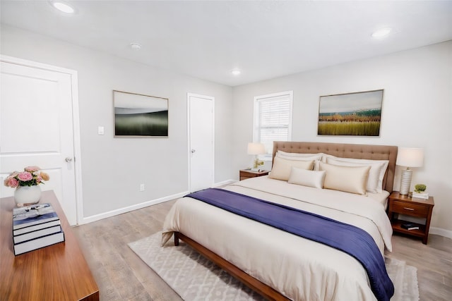 bedroom with light wood-type flooring