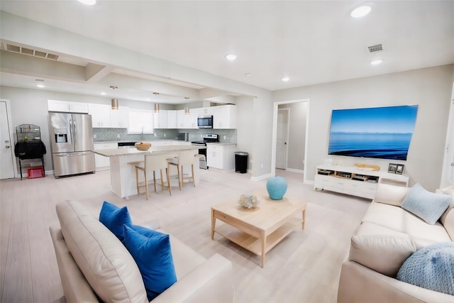 living room with light hardwood / wood-style floors