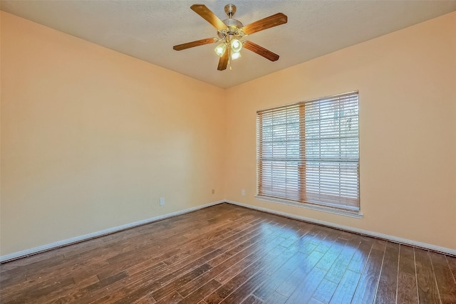 spare room featuring a textured ceiling, ceiling fan, and wood-type flooring